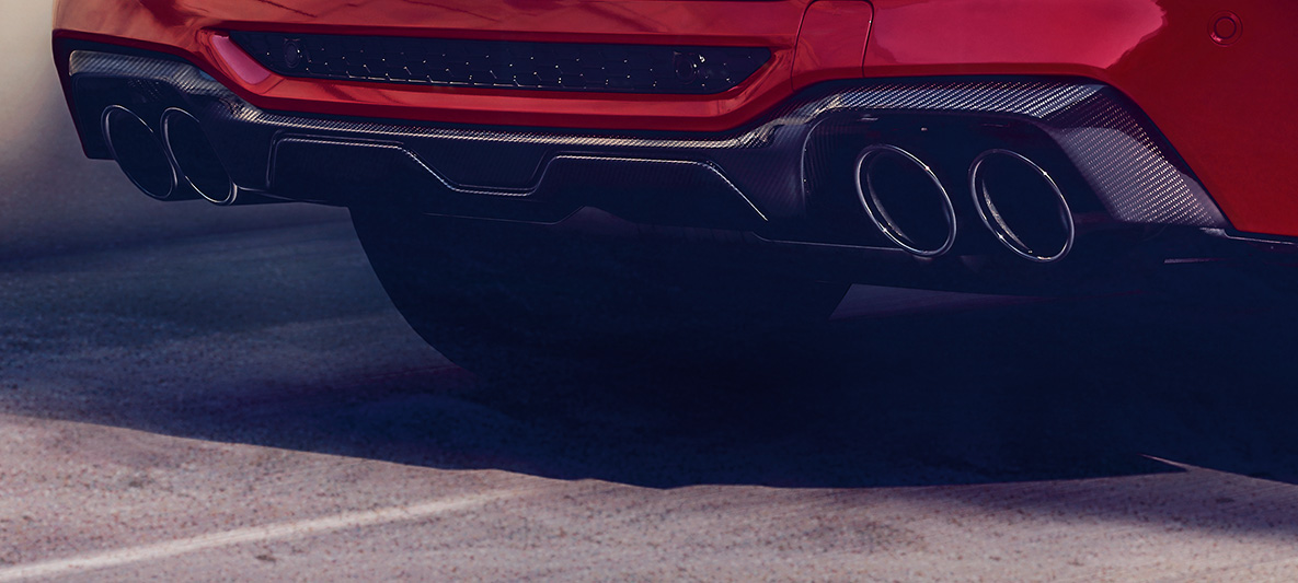 BMW X4 M Competition, zadnji difuzor od karbona. BMW X4 M Competition u boji Toronto Red metaliziranoj, eksterijer, M Carbon paket eksterijera, zadnji difuzor od karbona.